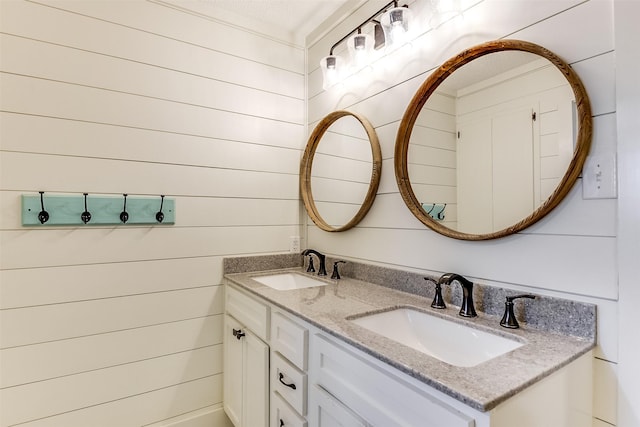 bathroom featuring double vanity and a sink