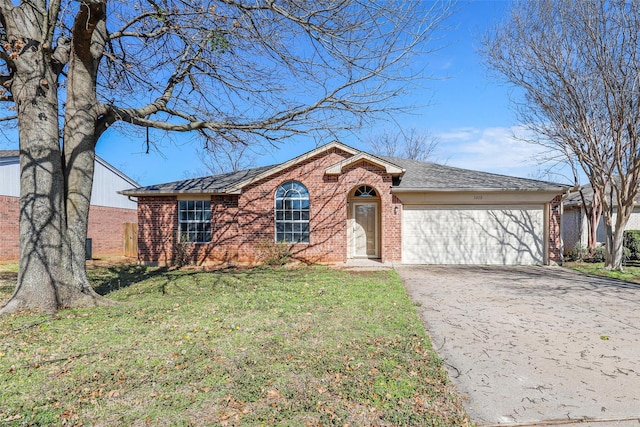 single story home featuring driveway, a shingled roof, a front lawn, a garage, and brick siding