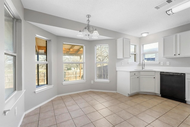 kitchen with dishwasher, light countertops, white cabinetry, and a sink