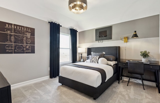 bedroom featuring baseboards, carpet, and vaulted ceiling