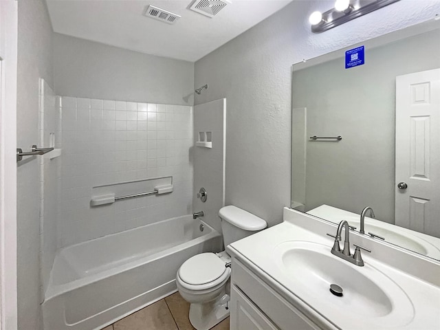 bathroom featuring tile patterned floors, visible vents, toilet, and vanity