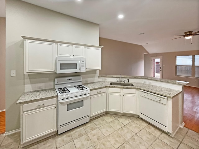 kitchen featuring a peninsula, white appliances, white cabinetry, a ceiling fan, and a sink