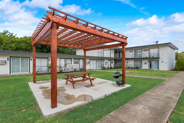 view of community featuring a patio, fence, a lawn, and a pergola