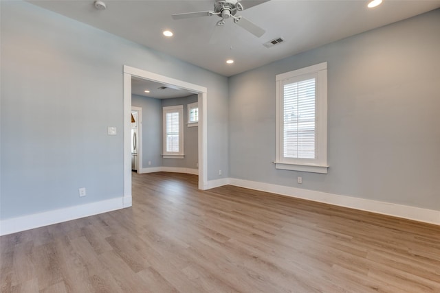 empty room with visible vents, wood finished floors, recessed lighting, baseboards, and ceiling fan