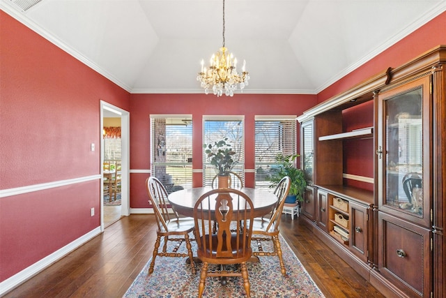 dining space featuring a chandelier, lofted ceiling, baseboards, and dark wood finished floors