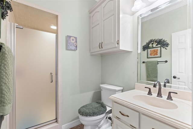 full bath with vanity, toilet, and a stall shower