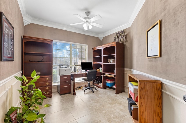 office space with light tile patterned floors, wainscoting, crown molding, and a ceiling fan