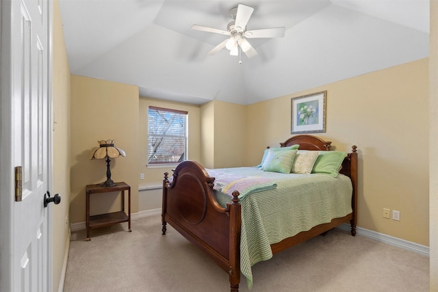 bedroom with vaulted ceiling, light colored carpet, baseboards, and ceiling fan