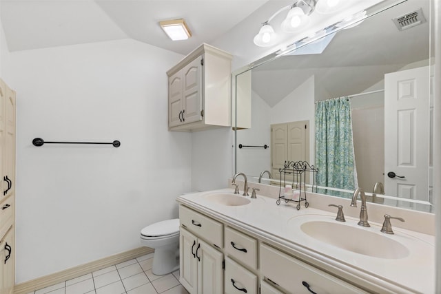 bathroom featuring vaulted ceiling, visible vents, toilet, and a sink