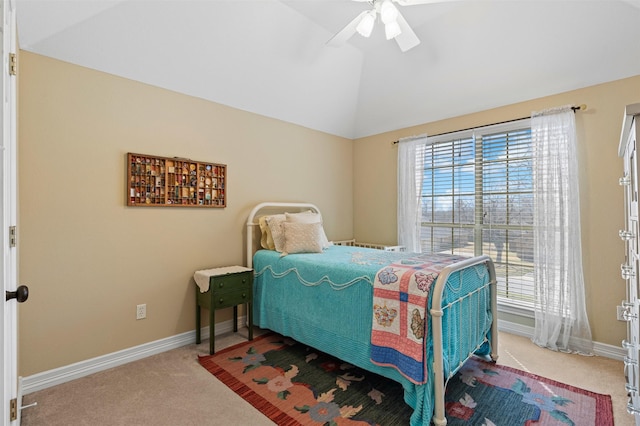 carpeted bedroom featuring lofted ceiling, multiple windows, and baseboards