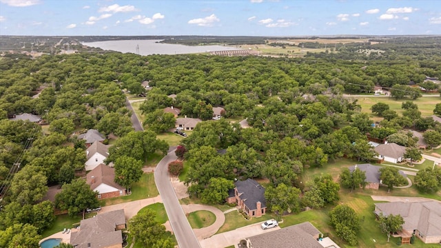 drone / aerial view with a residential view and a water view