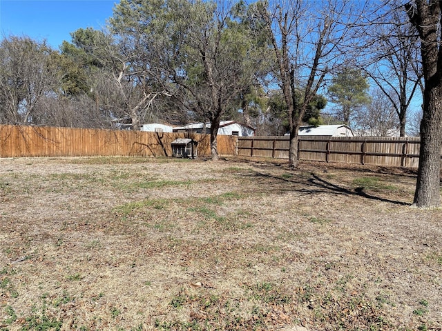 view of yard with a fenced backyard