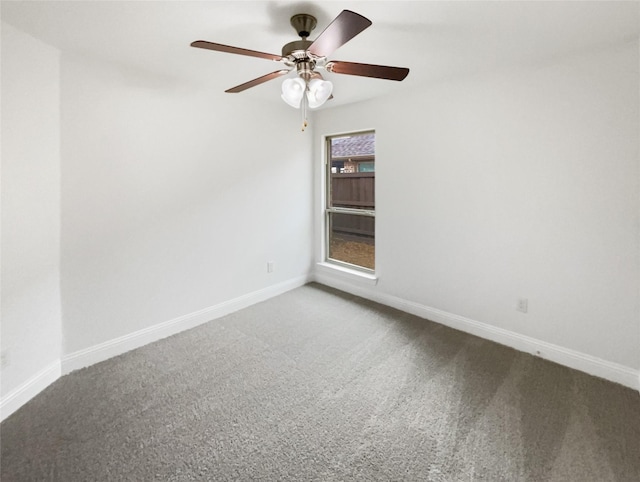 empty room featuring a ceiling fan, baseboards, and carpet floors