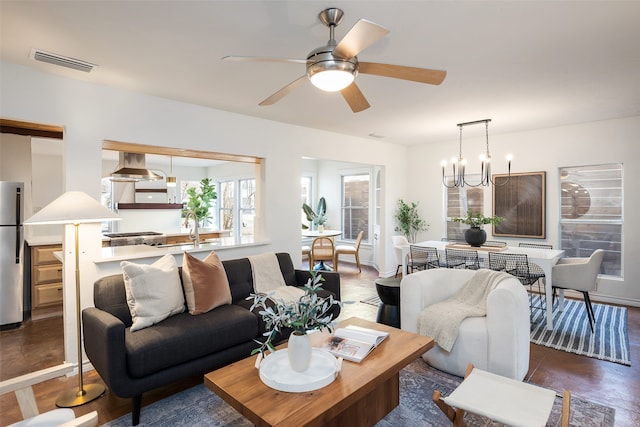 living room with visible vents and ceiling fan
