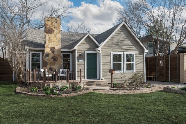 view of home's exterior featuring a vegetable garden and fence