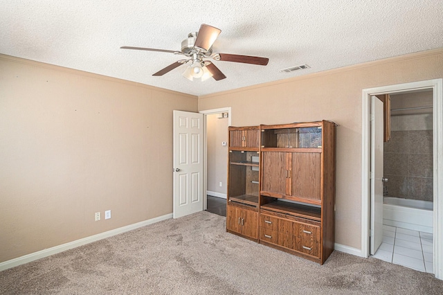 6908 Sunnybank Dr, Fort Worth, TX 76137 - unfurnished bedroom with carpet flooring, a textured ceiling, baseboards, ensuite bath, and ceiling fan