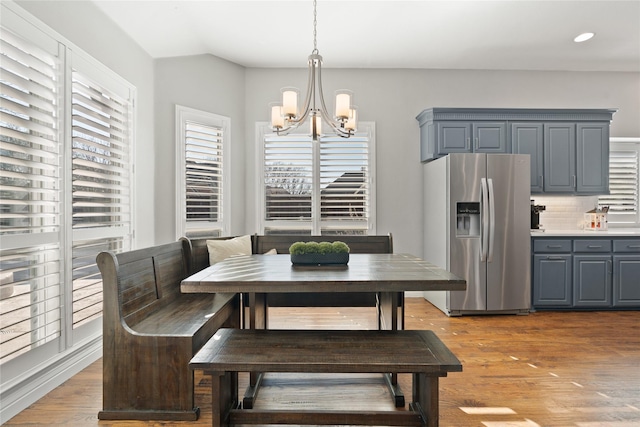 dining area featuring recessed lighting, light wood-type flooring, a chandelier, and breakfast area