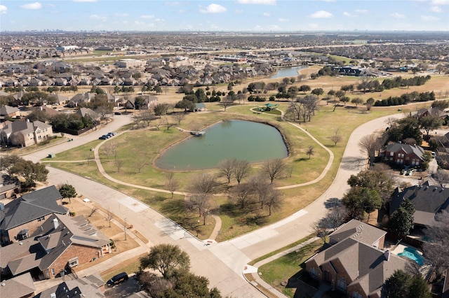 bird's eye view featuring a water view and a residential view