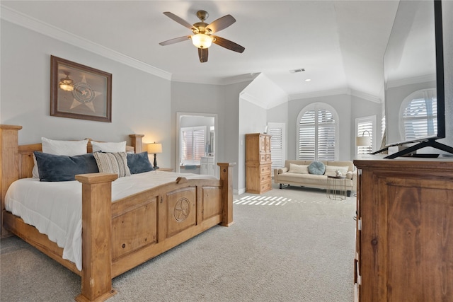 bedroom with visible vents, light colored carpet, lofted ceiling, ornamental molding, and a ceiling fan