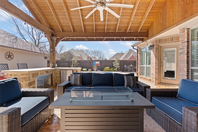 view of patio / terrace featuring outdoor lounge area and fence