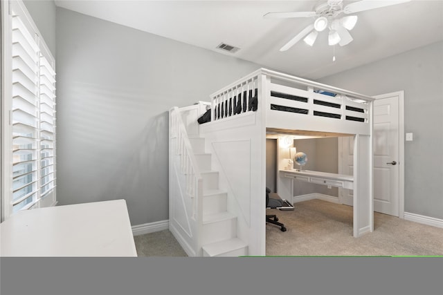 bedroom with visible vents, baseboards, ceiling fan, and carpet flooring