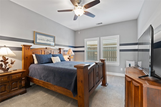 bedroom with visible vents, baseboards, carpet, and a ceiling fan