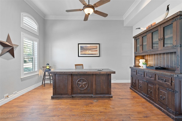 home office with baseboards, wood finished floors, and ornamental molding