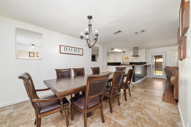 dining space featuring visible vents, baseboards, and a chandelier