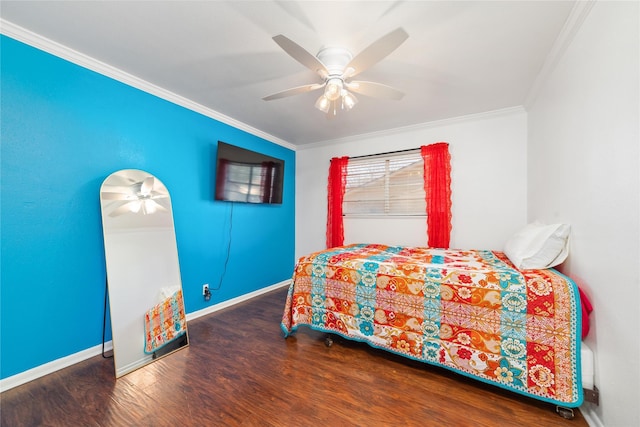 bedroom with ceiling fan, baseboards, wood finished floors, and crown molding