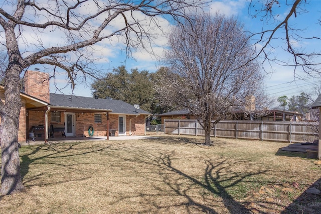 view of yard featuring a patio area and fence