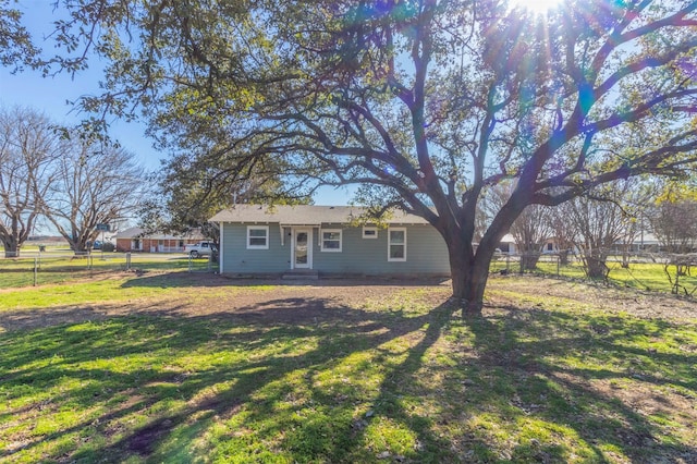 single story home featuring a front yard and fence