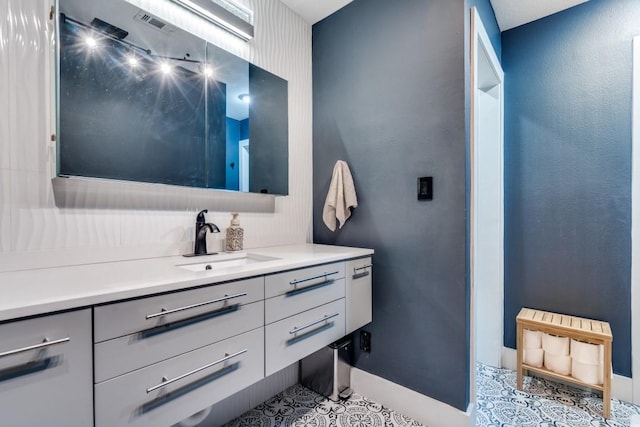 bathroom with vanity and tile patterned flooring