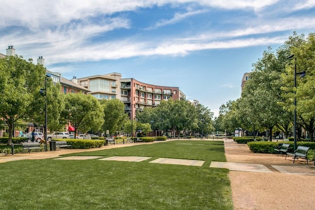 view of property's community with a yard