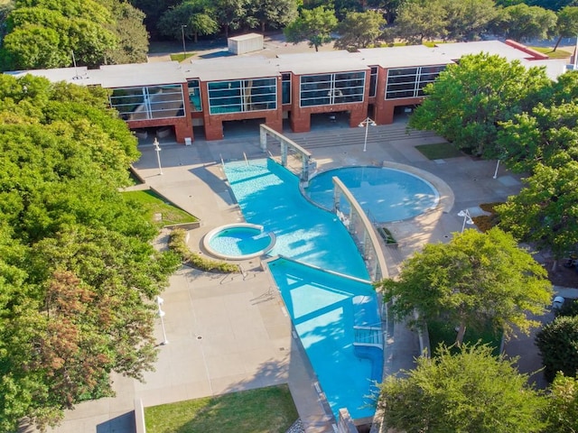 view of swimming pool with a pool with connected hot tub