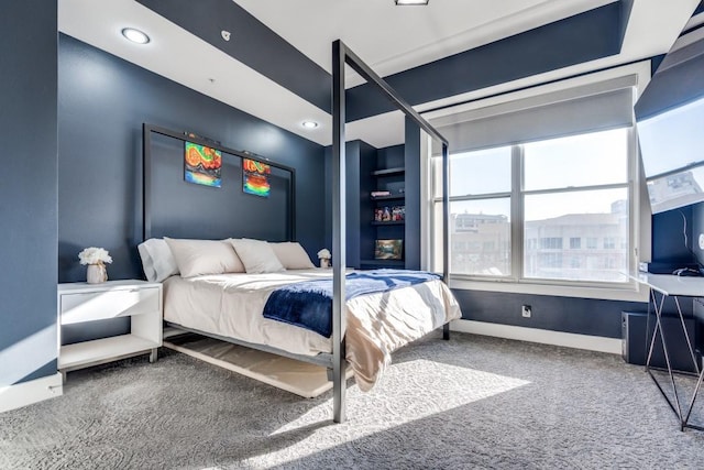 bedroom with baseboards and carpet floors