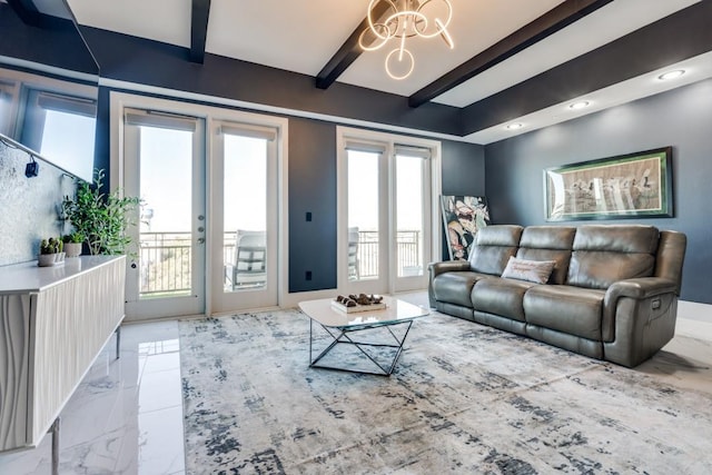 living area with beam ceiling, a notable chandelier, and marble finish floor