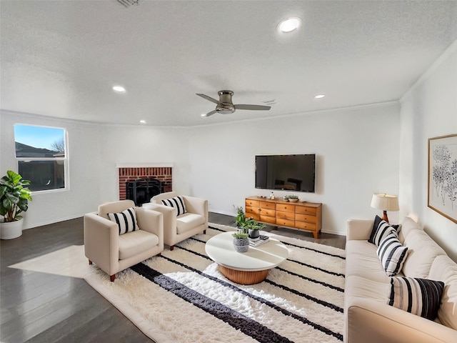 living area featuring wood finished floors, recessed lighting, and a fireplace