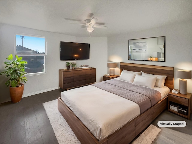 bedroom featuring ceiling fan, baseboards, and hardwood / wood-style floors