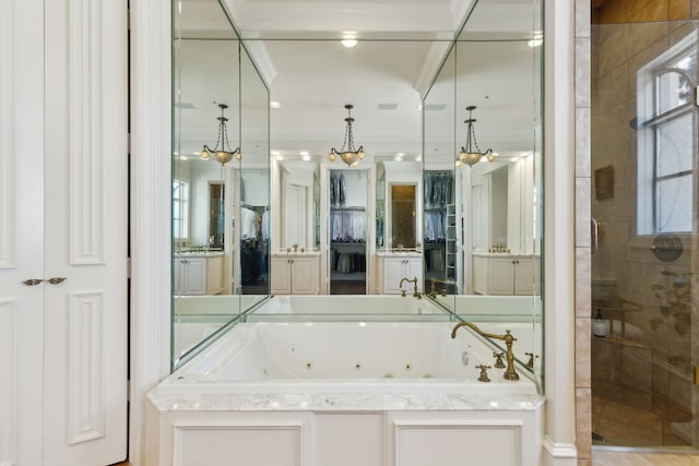 bathroom with vanity, visible vents, a shower stall, crown molding, and a jetted tub