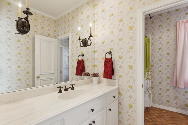 bathroom with wallpapered walls, baseboards, ornamental molding, tile patterned floors, and vanity