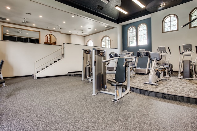 workout area featuring recessed lighting, visible vents, and crown molding