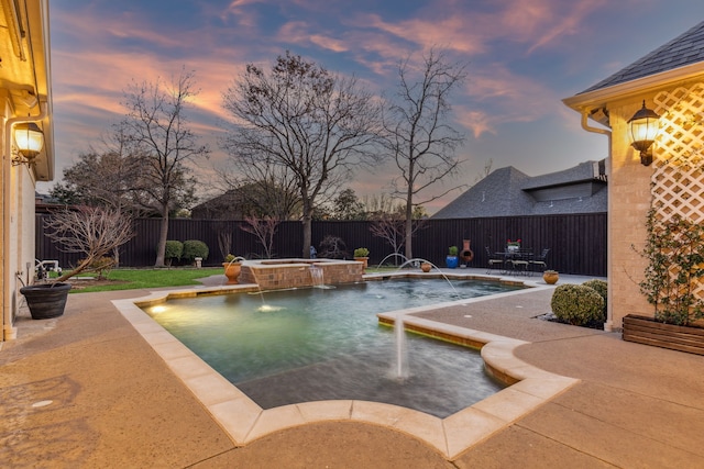 pool at dusk featuring a patio, a jacuzzi, a fenced backyard, and a fenced in pool