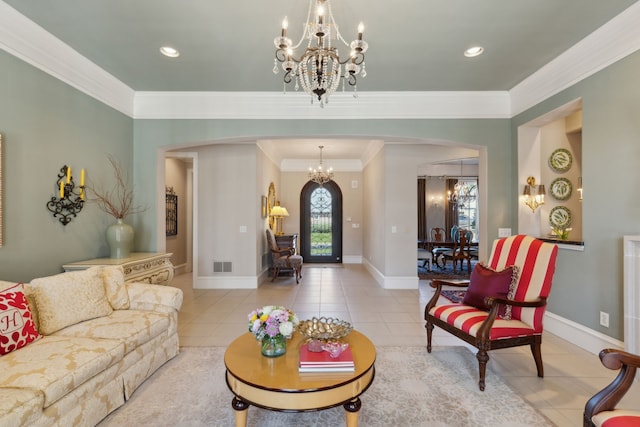 living area featuring visible vents, crown molding, an inviting chandelier, light tile patterned flooring, and arched walkways