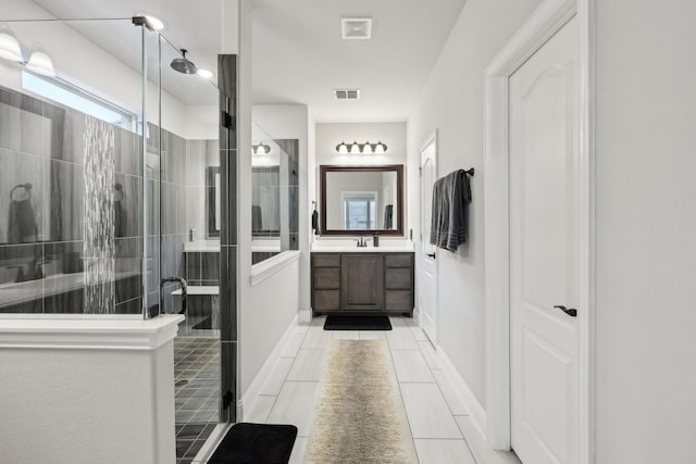 bathroom with vanity, visible vents, and a stall shower