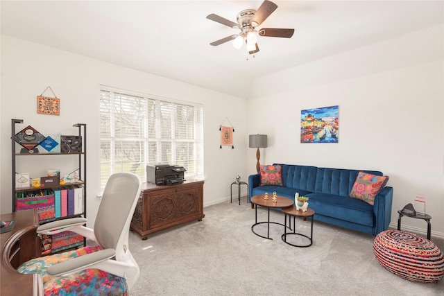 office featuring a ceiling fan, lofted ceiling, carpet, and baseboards