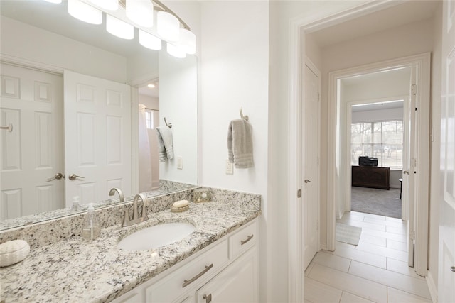 bathroom featuring tile patterned floors and vanity