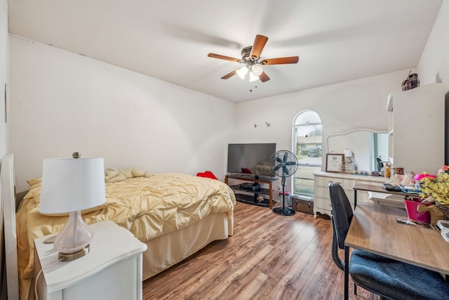 bedroom with a ceiling fan and wood finished floors