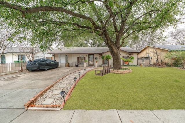 view of front of home with a front lawn and fence