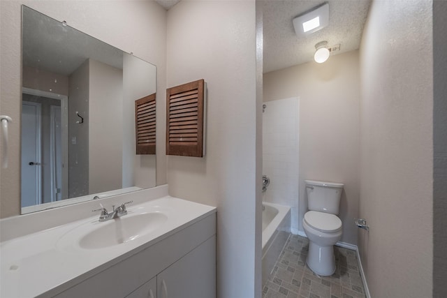 bathroom with baseboards, toilet, vanity, shower / bathtub combination, and a textured ceiling