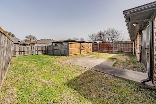 view of yard featuring a patio area and a fenced backyard